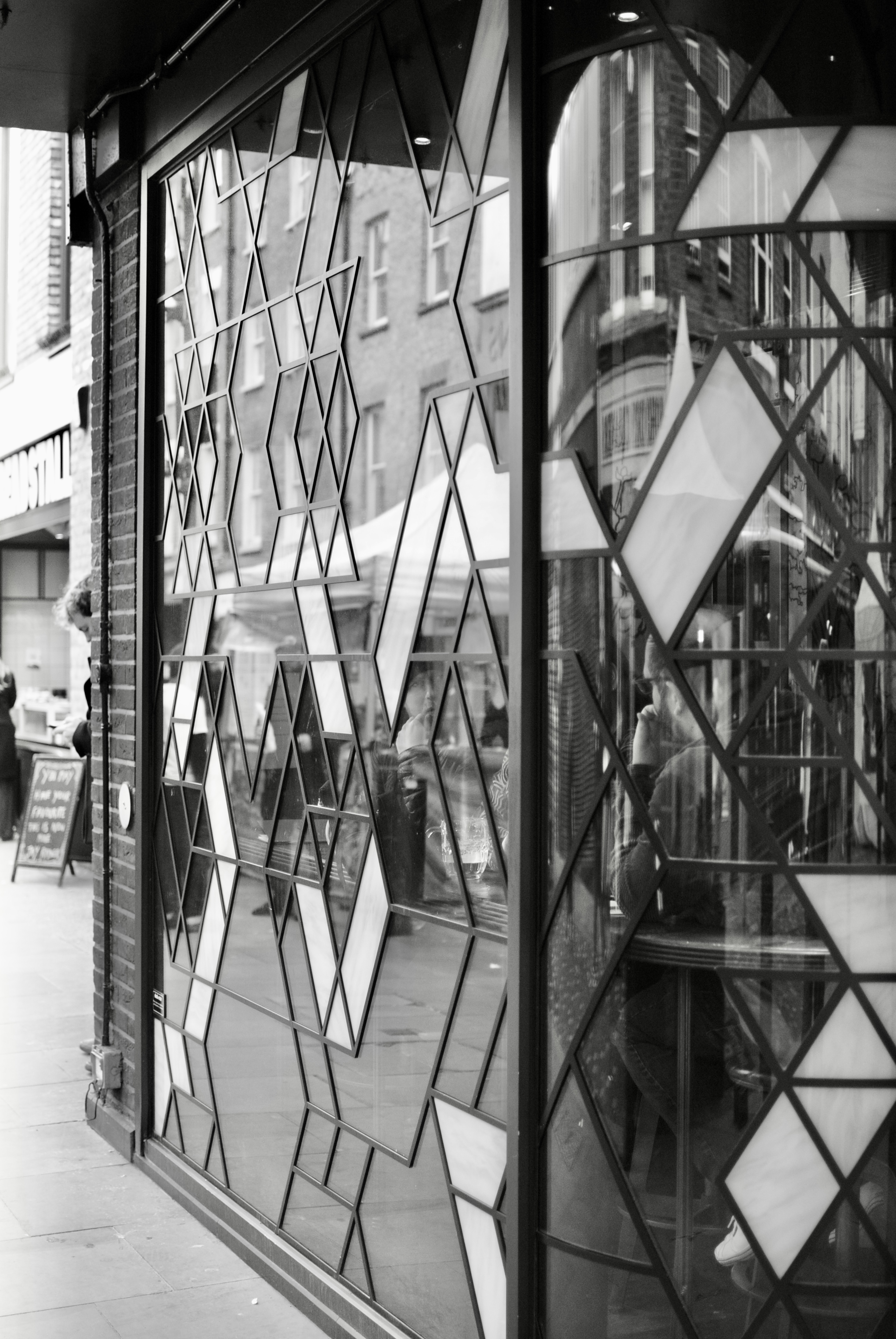 A cut glass leaded window with clear reflections